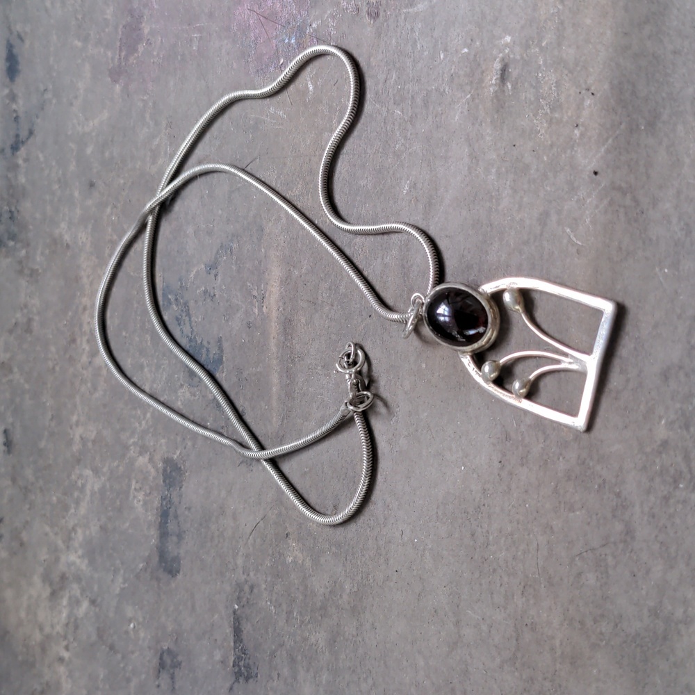 Sterling silver and garnet floral pendant necklace